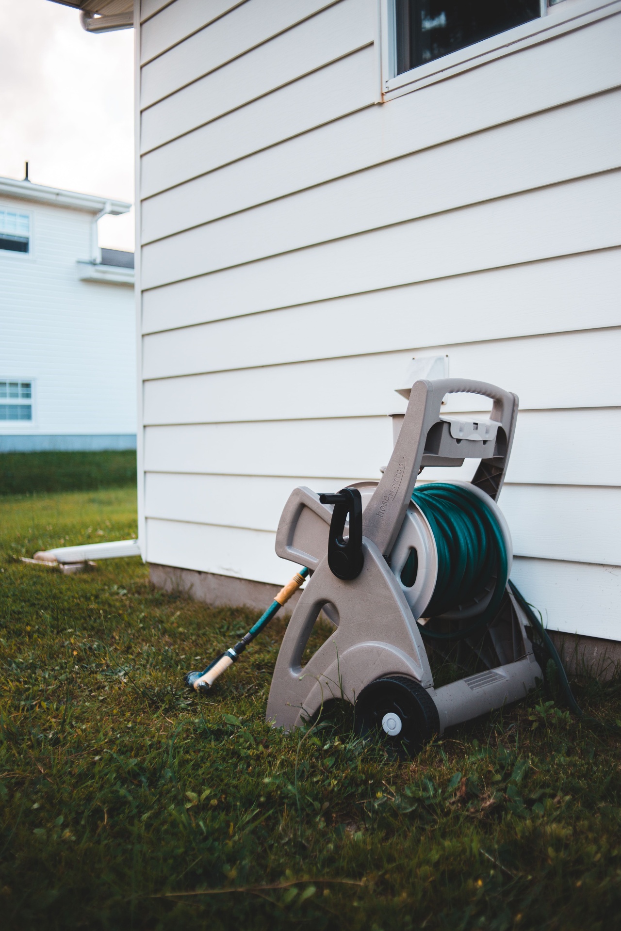 Pressure washing equipment beside home